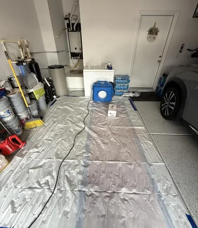 Storm water damage across the floor and lower walls of a home